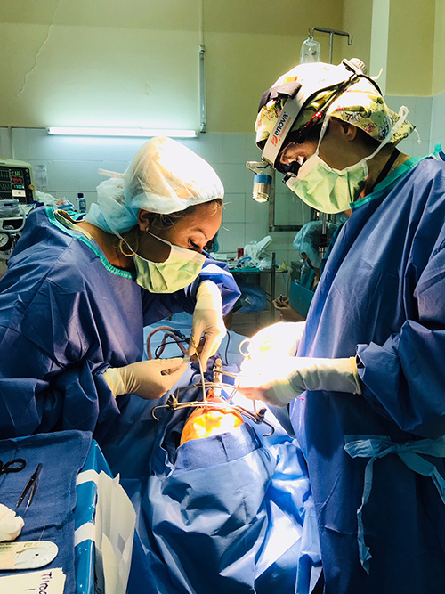 Dr. Kathleen Waldorf performs surgery on children as part of Project Vietnam.